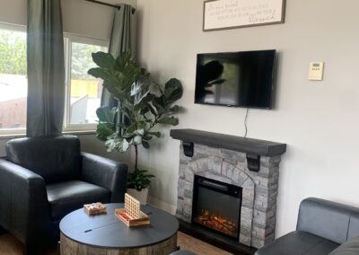Lobby fireplace and chairs at Boulder Post Acute