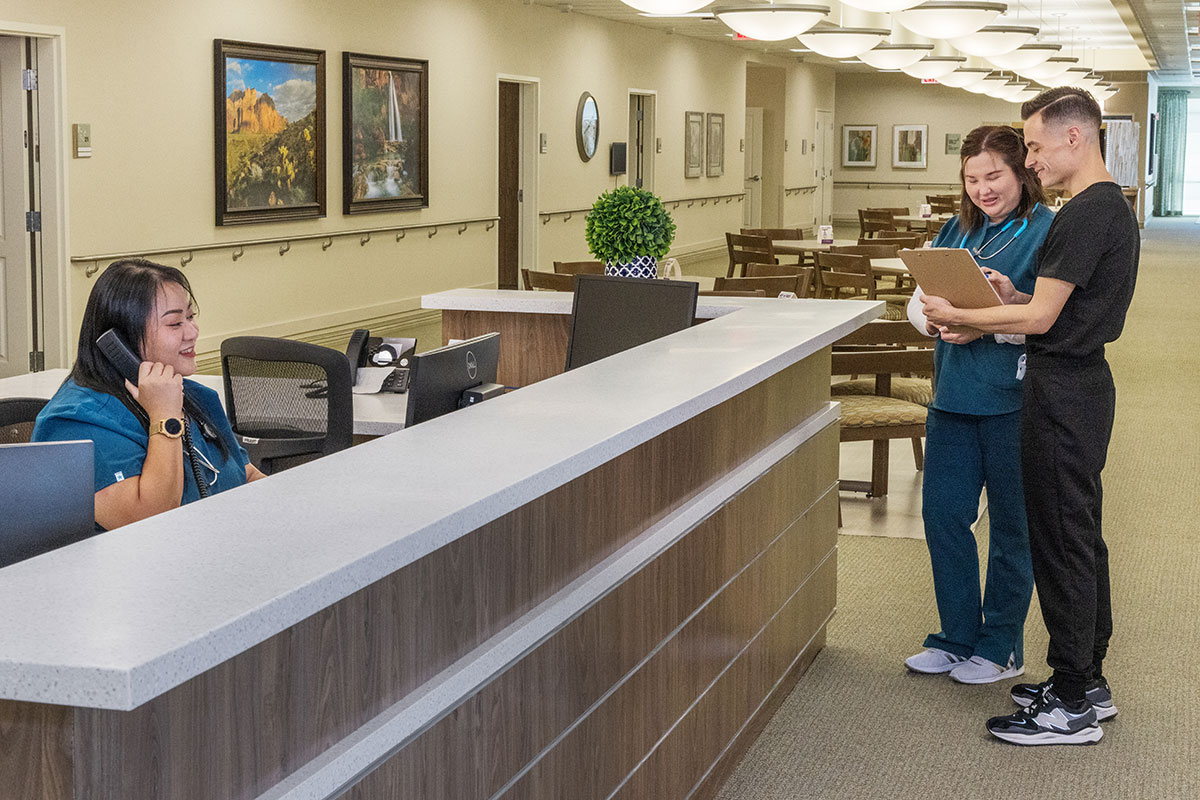 Several nurses standing in the hallway