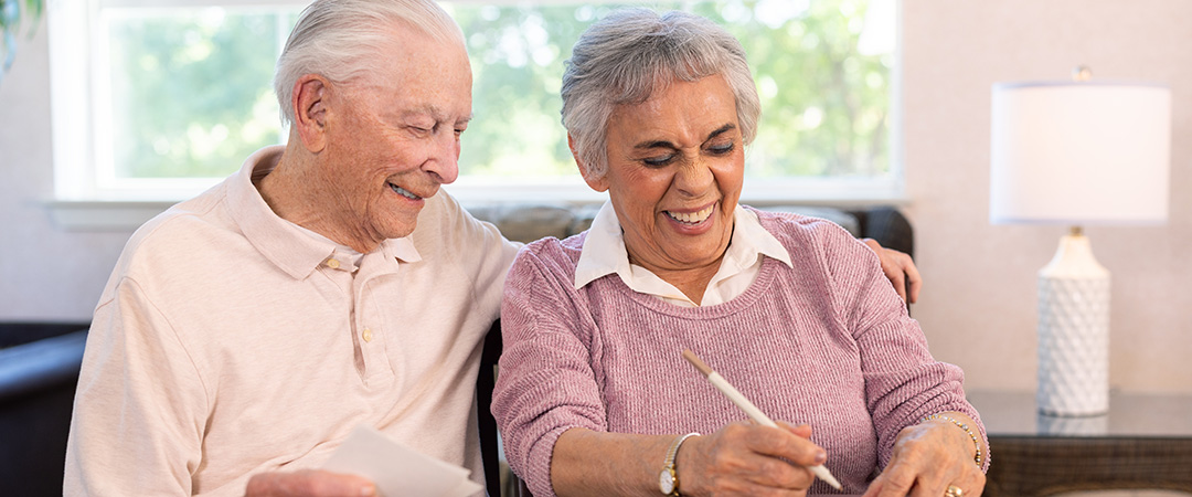 An elderly couple sitting together